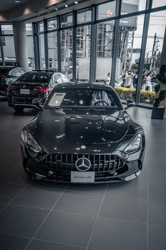 Front view of a sleek Mercedes-Benz car displayed inside a Kyoto showroom, Japan.